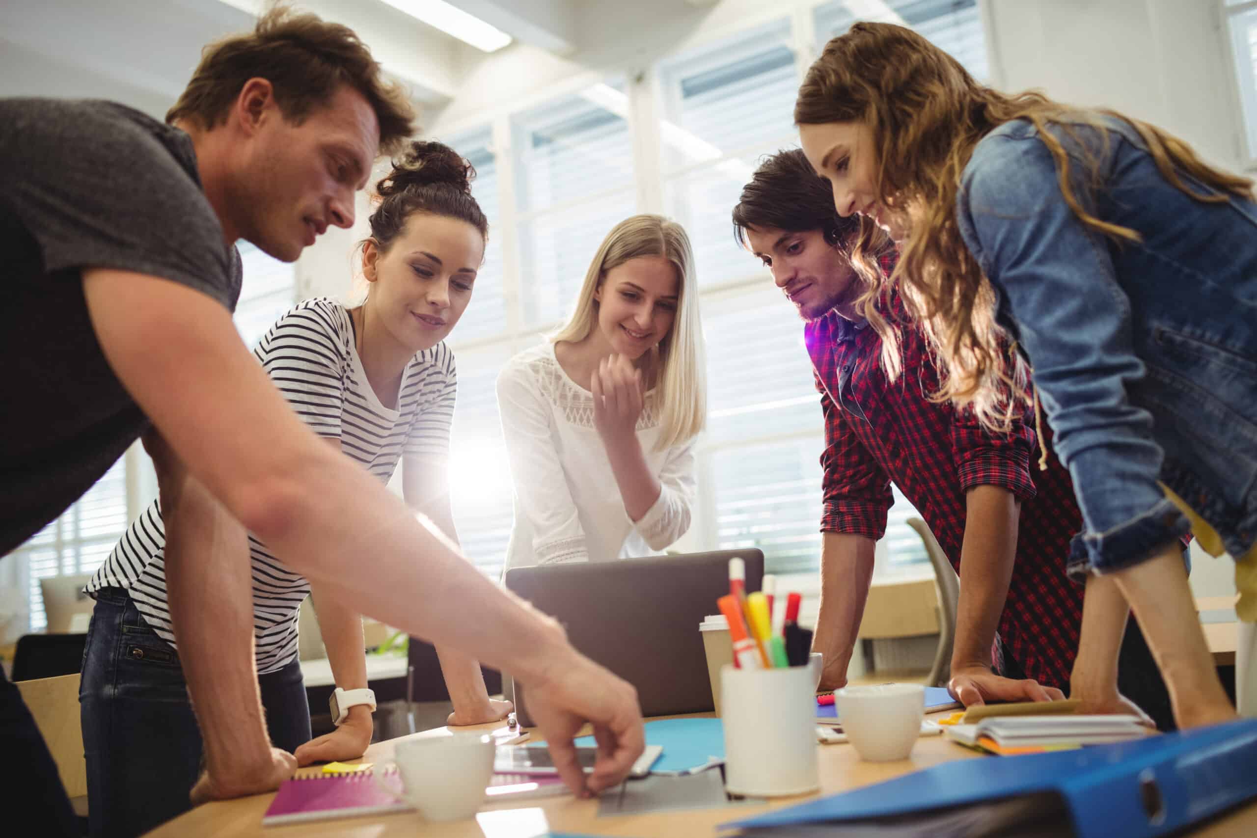 graphic-designers-in-meeting-scaled